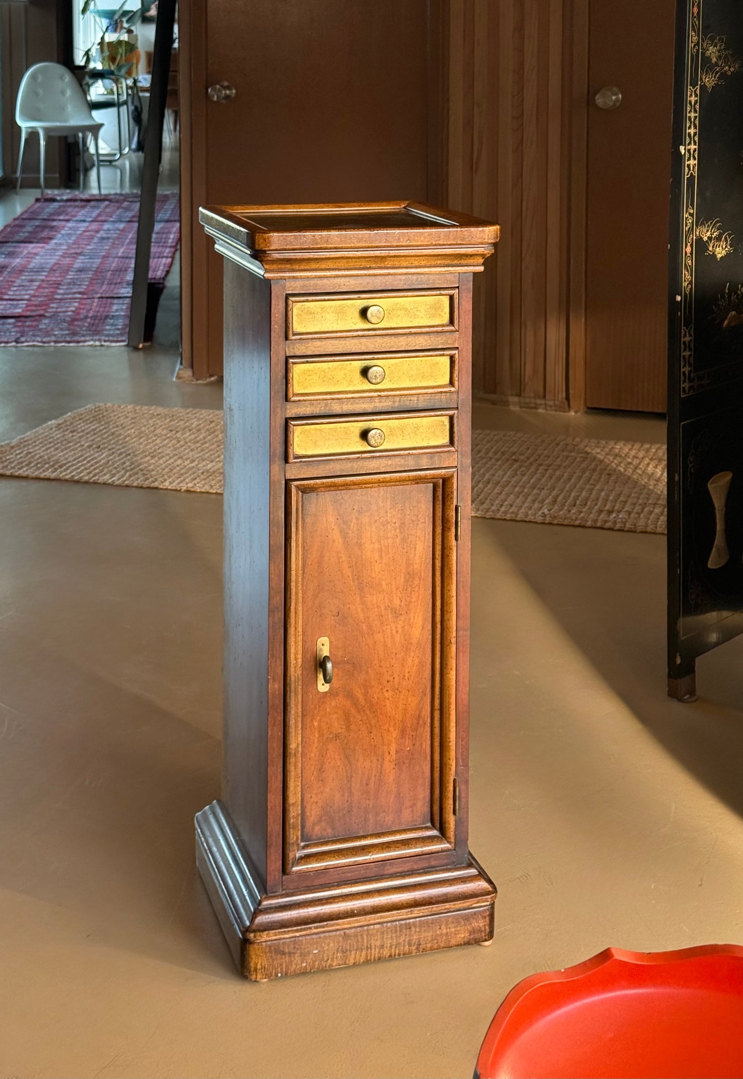 Wood and brass pedestal cabinet with pocket drawers, late 19th century
