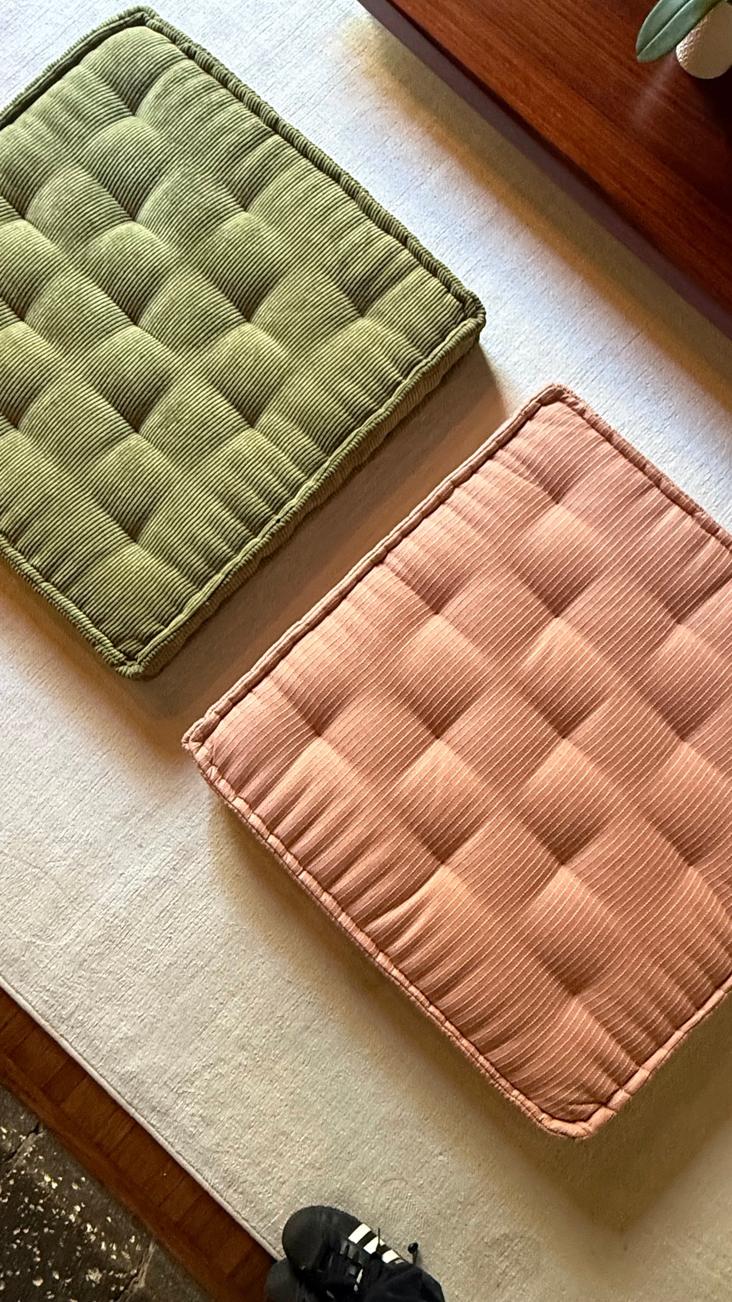 A pair of large floor cushions, 21st century