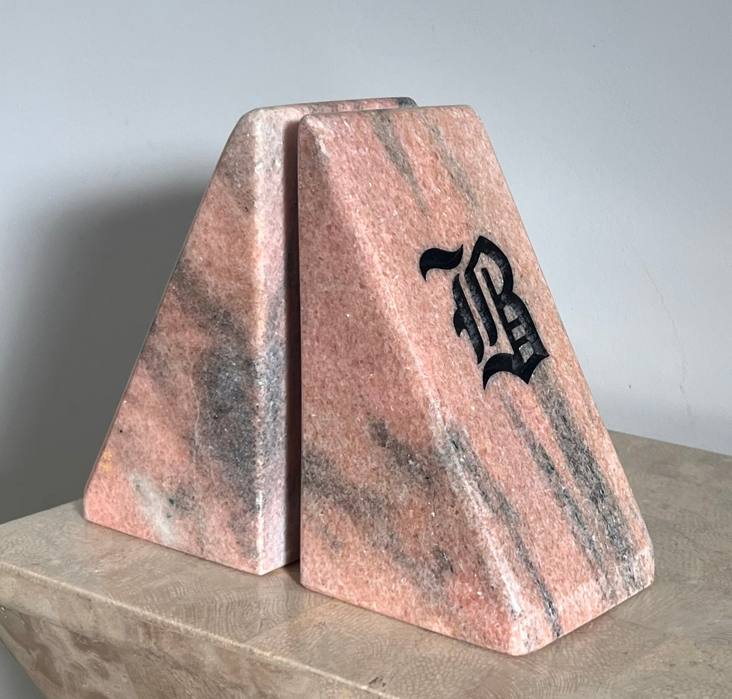 Postmodern pink marble “B” bookends, 20th century