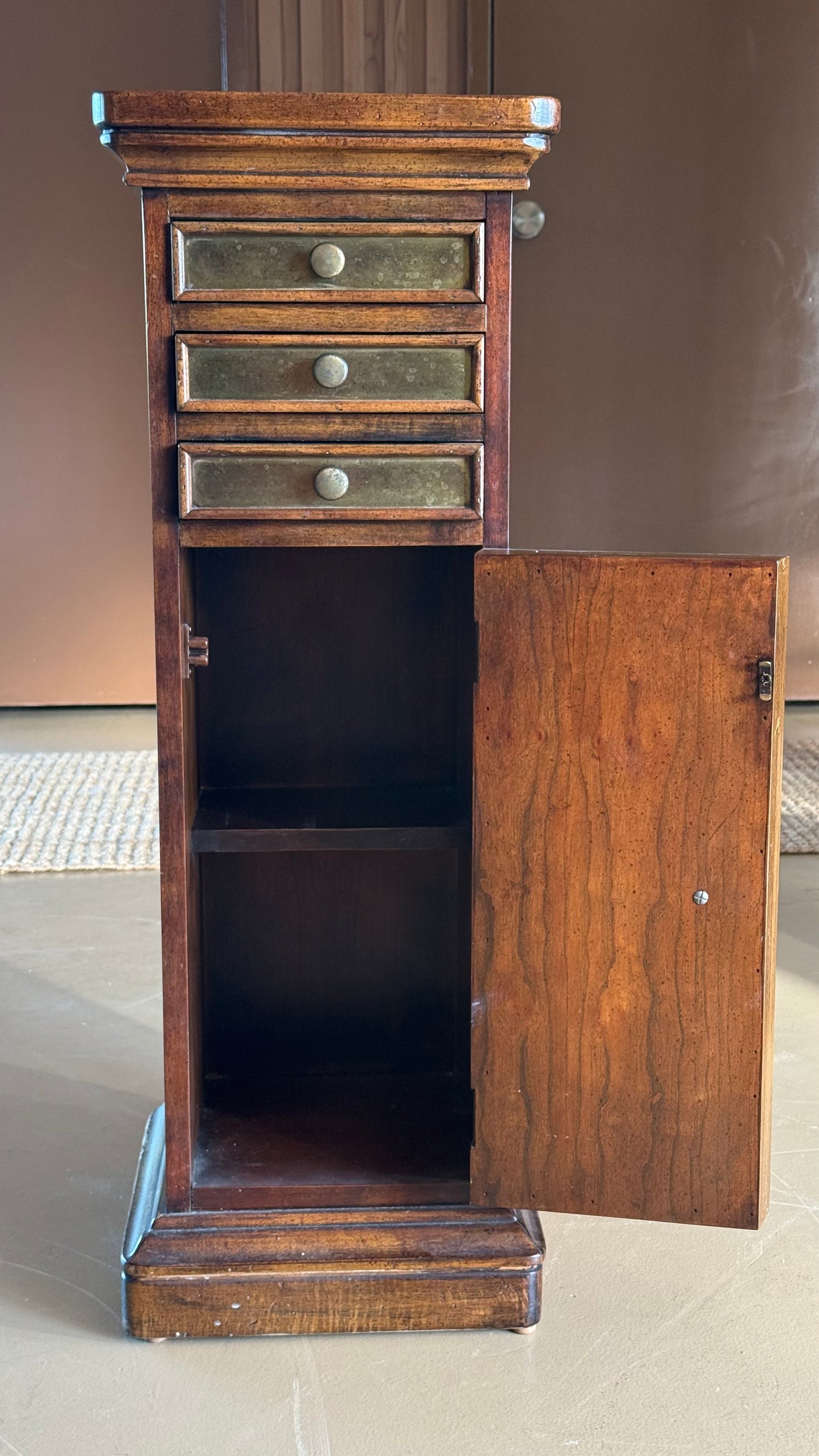 Wood and brass pedestal cabinet with pocket drawers, late 19th century