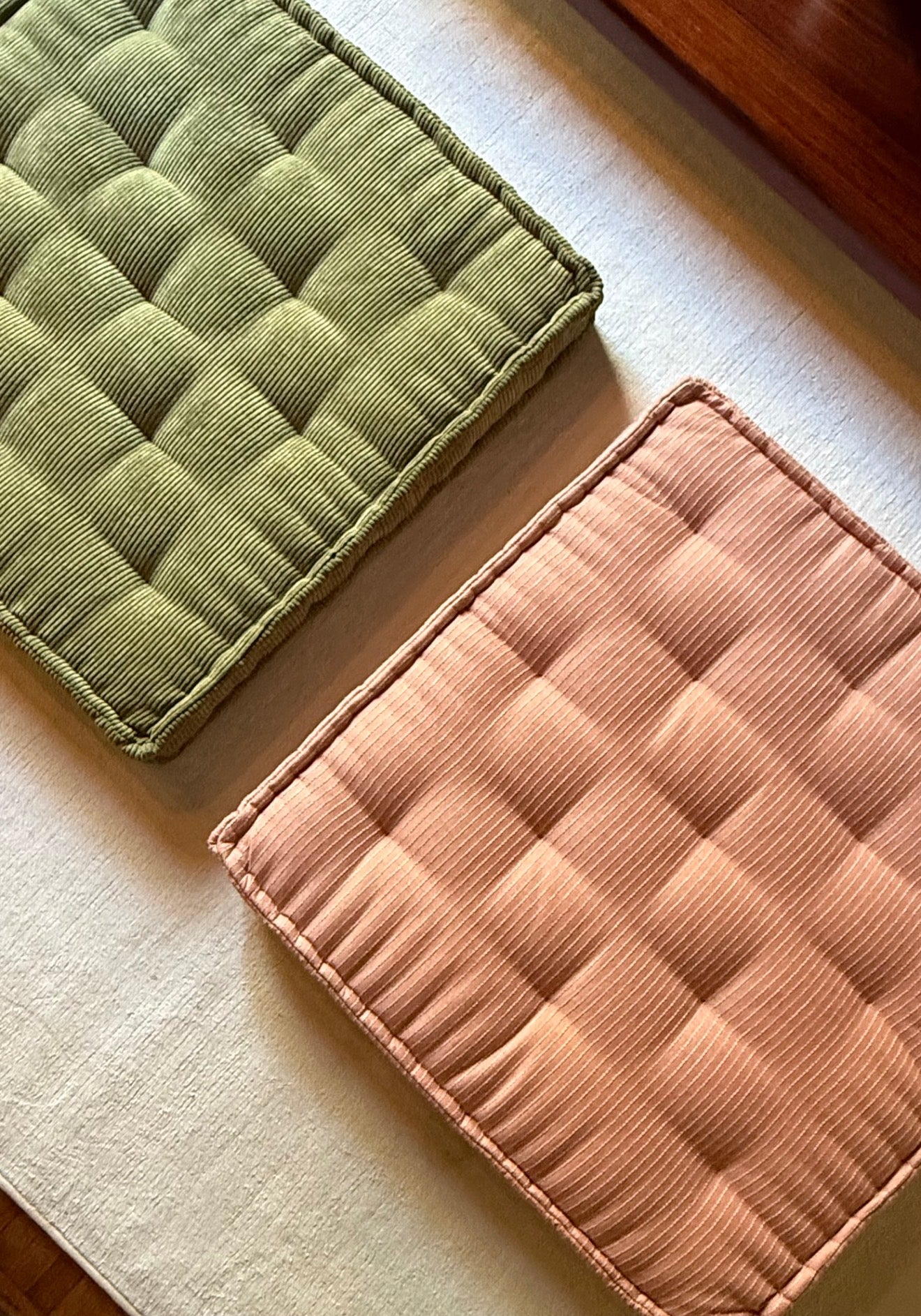 A pair of large floor cushions, 21st century
