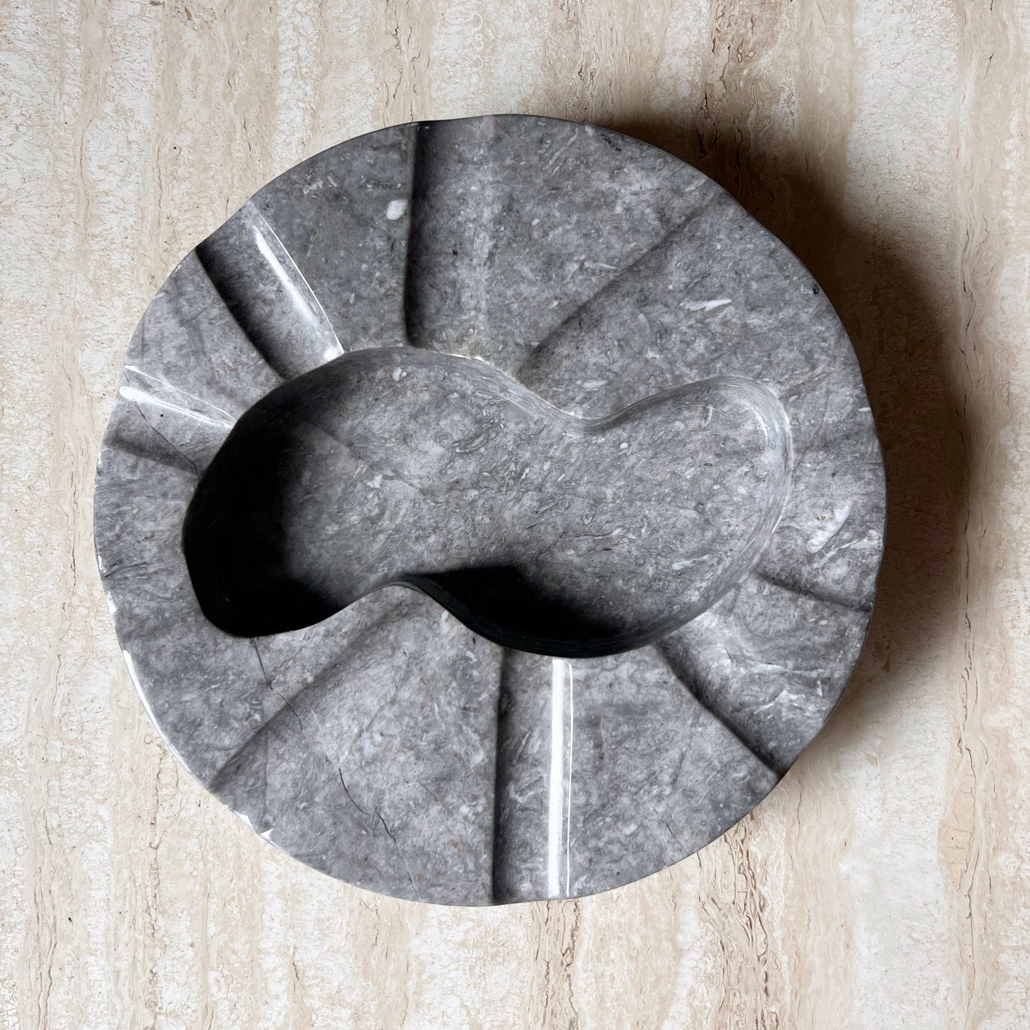 Monumental Italian granite ashtray with biomorphic carving, circa 1970
